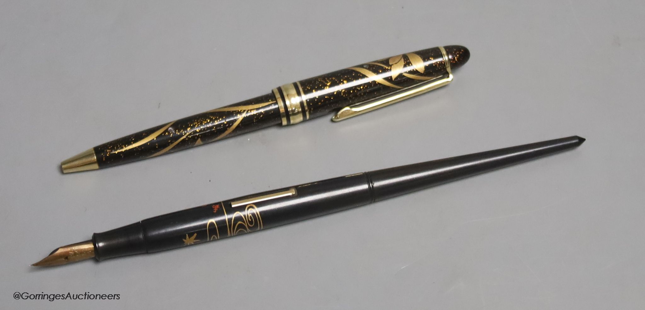 A Japanese lacquer maki-e dip style fountain pen with Dunhill Namiki nib, and a maki-e ballpoint pen